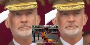 Em um momento constrangedor, o rei observa a queda da bandeira espanhola durante uma cerimônia militar